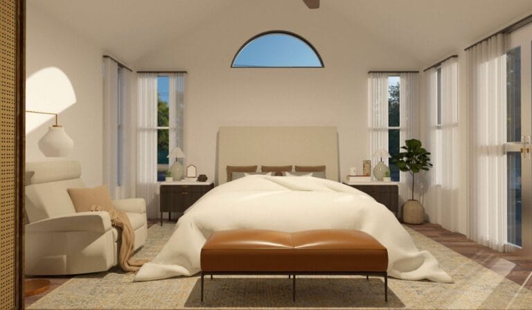 Diseño de Interiores Online _ Decoratic - Plataforma de diseño de interiores Un dormitorio espacioso con una cama grande, un cabecero tapizado, dos mesitas de noche, un cómodo sillón, un banco de cuero y una planta en maceta. La habitación cuenta con grandes ventanales y un techo alto y abovedado.