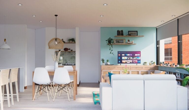 Diseño de Interiores Online _ Decoratic - Plataforma de diseño de interiores Una moderna sala de estar y comedor de planta abierta con una pared con acento azul claro, muebles blancos, TV montada en la pared y grandes ventanas que dejan entrar la luz natural.