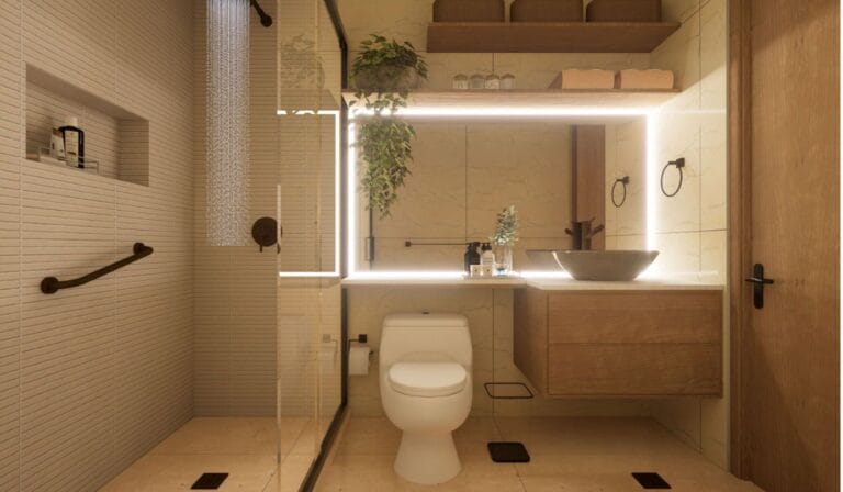 Diseño de Interiores Online _ Decoratic - Plataforma de diseño de interiores Baño moderno con azulejos beige, ducha con mampara de cristal, inodoro blanco y tocador de madera con lavabo sobre encimera. También se ven un espejo iluminado, plantas y estanterías con cestas.